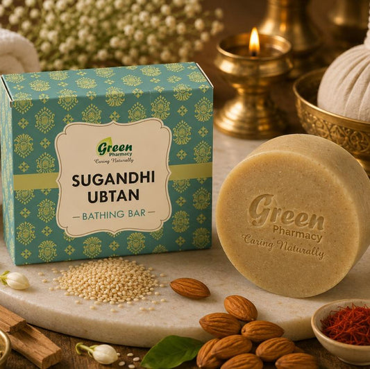 Green Pharmacy Sugandhi Ubtan bathing bar soap shown with its teal patterned box, alongside a round beige soap bar, almonds, jasmine flowers, spices, and a warm spa-style setup.