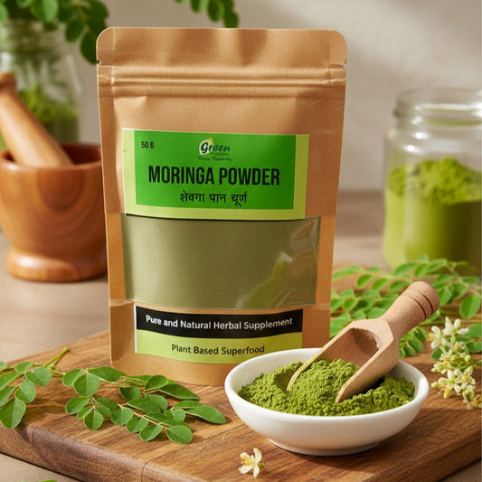 Moringa powder package on a wooden board with a bowl of powder and moringa leaves.