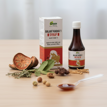 Bottle and box of Balant Kadha 1 Syrup with ingredients on a table