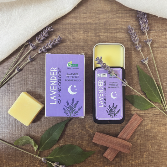 Lavender box and packaging on a wooden surface with lavender flowers and leaves.