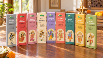 Nine colorful boxes of Green Brand Vastu Purushaam Kandal Samadhan Kit are lined up on a polished wooden table in a warm, traditional room setting.