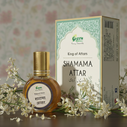 Shamama Attar bottle and packaging with flowers on a wooden surface